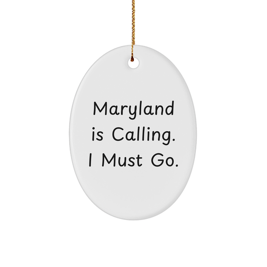 Maryland Gifts 'Maryland Is Calling. I Must Go.' Oval Ornament, Gifts from Friends to Family, Gifts for Maryland Enthusiasts, White Oval Shaped - Image 1